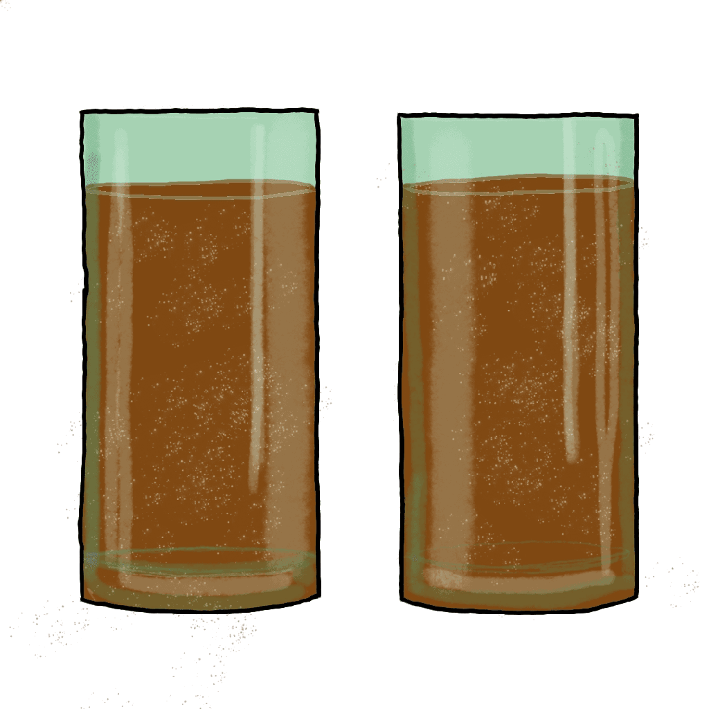 Two glasses filled with brown soda.