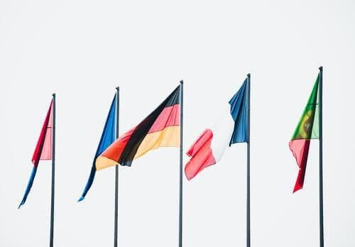 Flags from different countries in the world flying in the wind