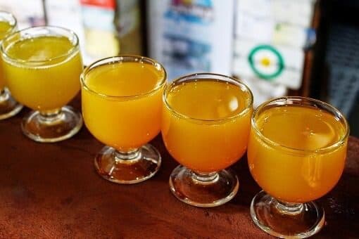 Four glasses of poncha, Madeira's cocktail made of lemon juice and honey