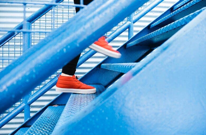 A person walking up a flight of stairs