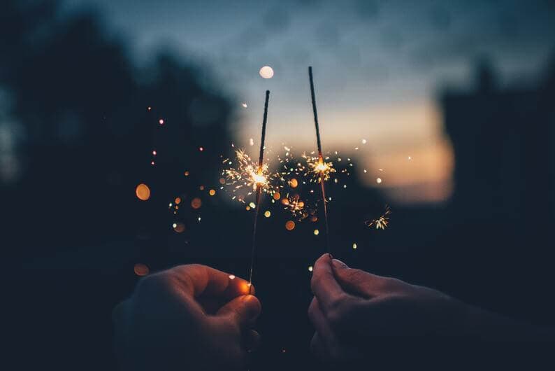 People hanging sparklers