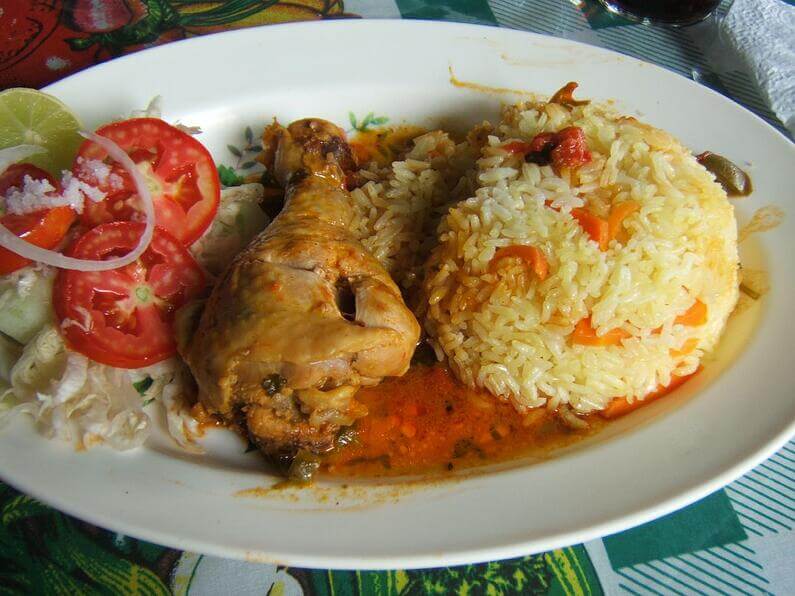 A plate of the traditional Dominican roasted chicken with rice
