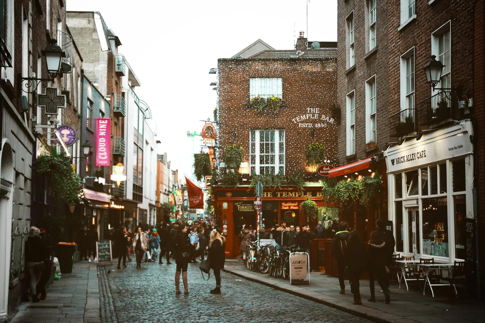 A busy Dublin street lined with pubs and shopfronts